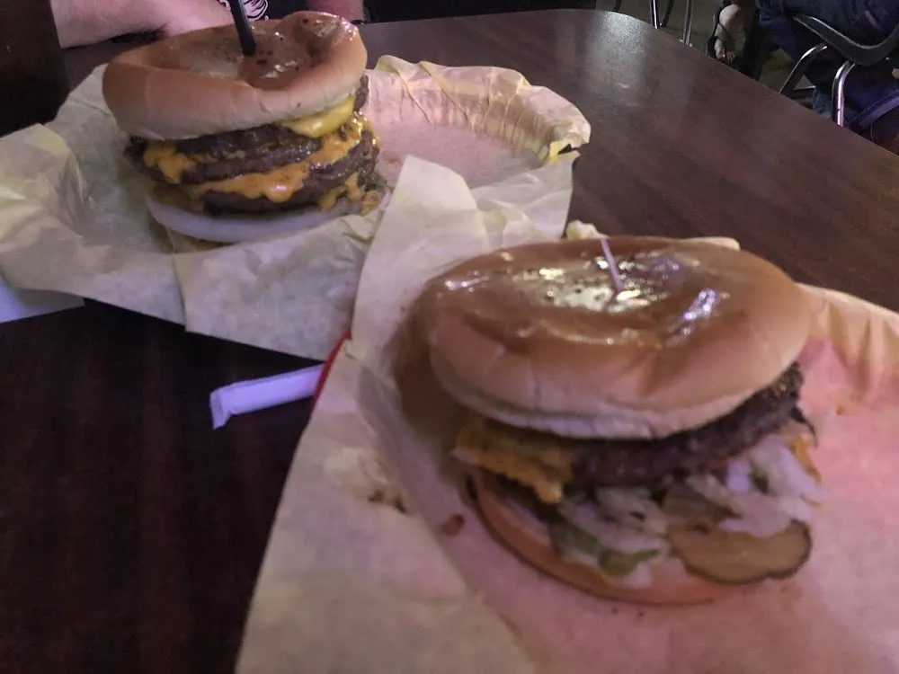 4 by 4 Cheeseburger on Left Double Cheeseburger on Right